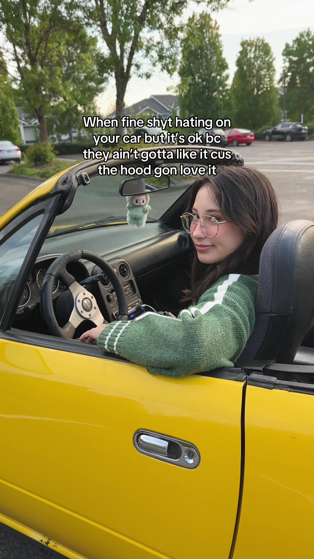 Showing off my custom-built yellow Miata despite its imperfections