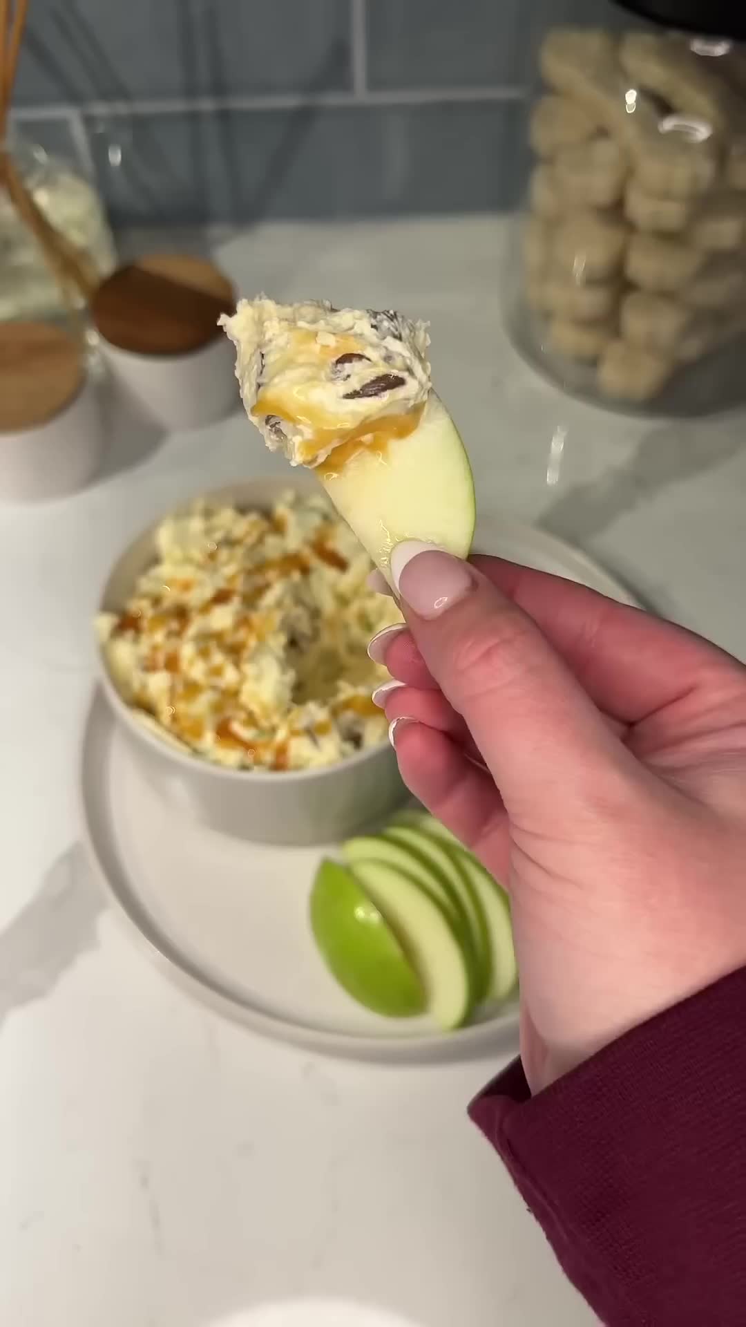 Candy bar pieces mixed with apples create sweet dessert salad