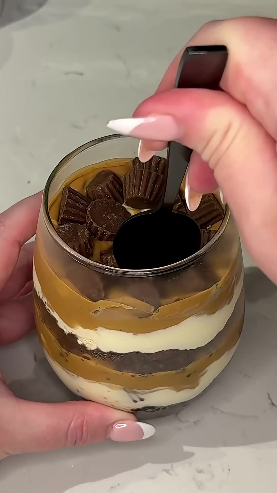 Three-layer dessert combines brownie base with peanut butter cheesecake