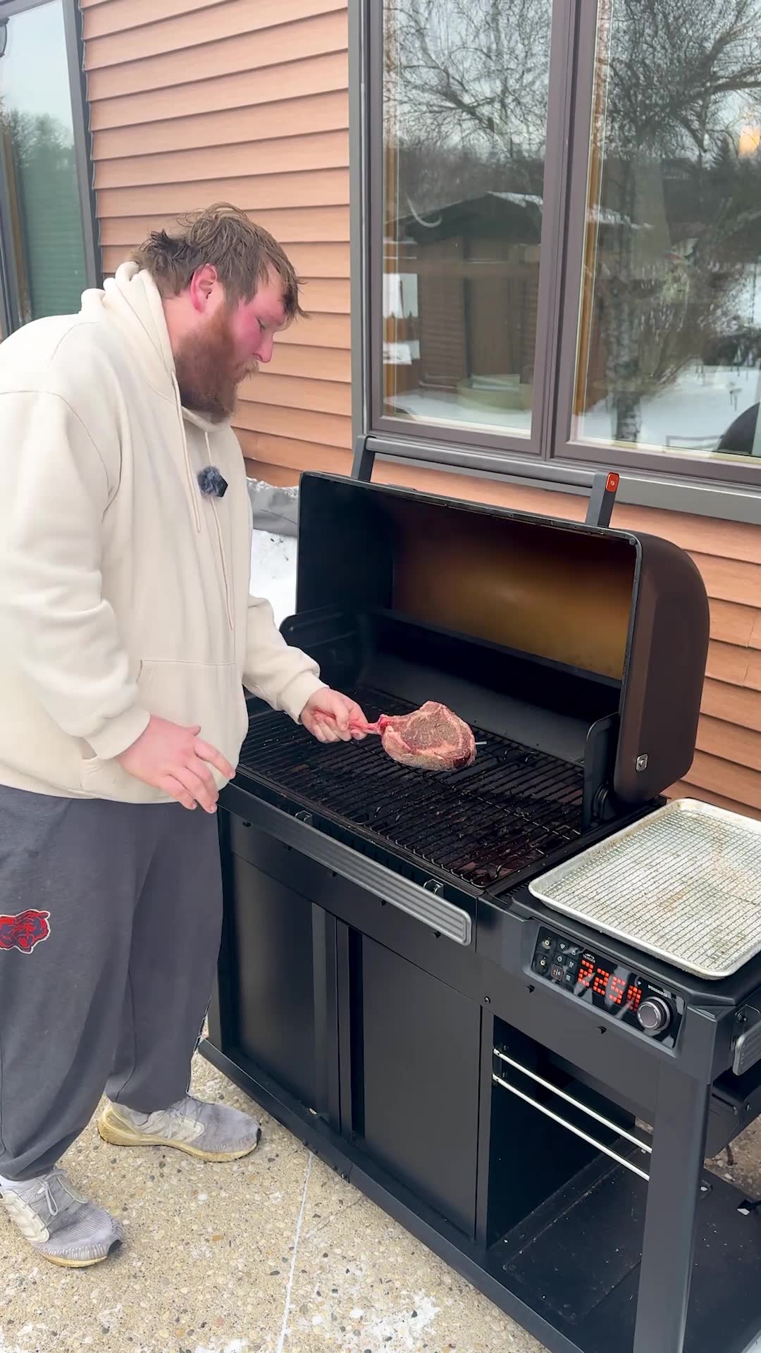 Grilling a stunning tomahawk steak outdoors in the middle of winter snow